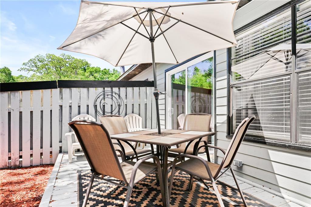 4401 Southwest 21st Lane Gainesville, FL 32607 - Photo 12 of 12 a view of a chairs and table in the patio