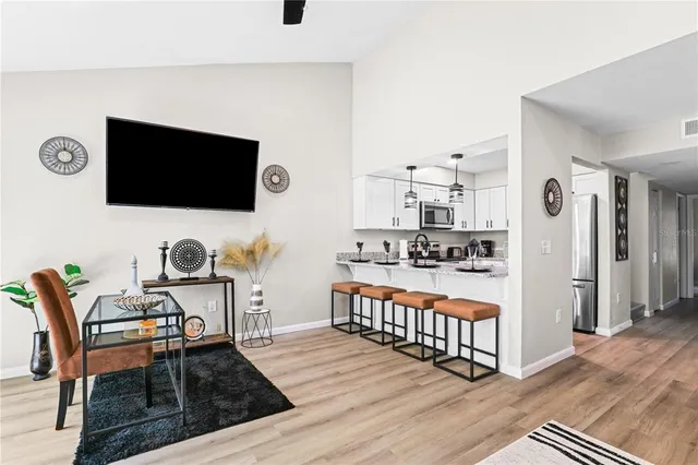 a outdoor living space with furniture and a flat screen tv