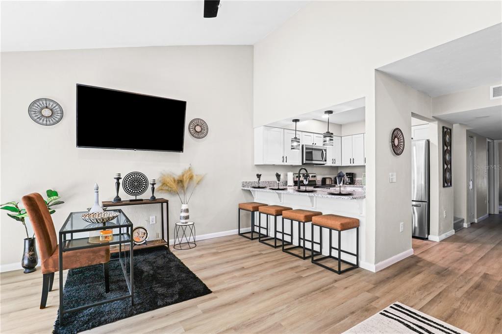 4401 Southwest 21st Lane Gainesville, FL 32607 - Photo 2 of 12 a outdoor living space with furniture and a flat screen tv