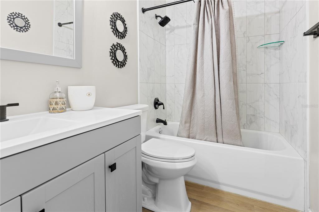 4401 Southwest 21st Lane Gainesville, FL 32607 - Photo 10 of 12 a bathroom with a sink a toilet and shower