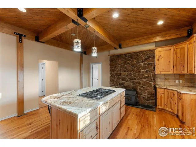 a kitchen that has a lot of cabinets in it