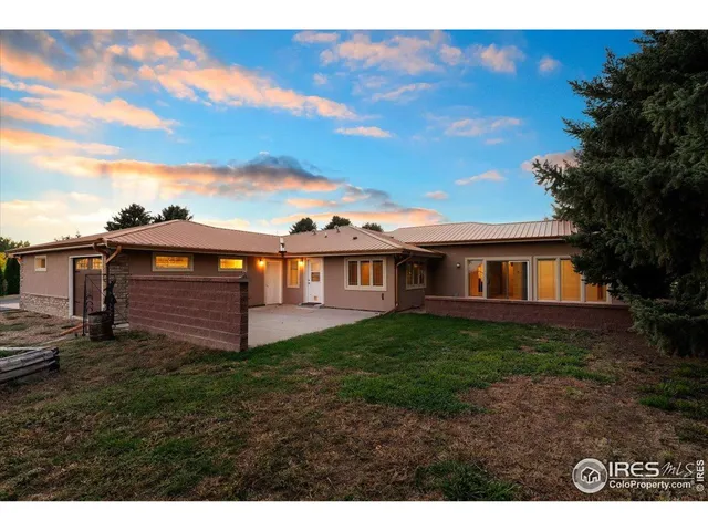 a view of a backyard of the house