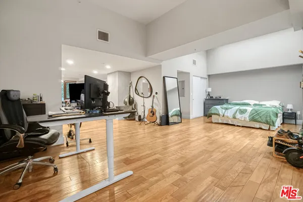 a view of a livingroom with furniture and a flat screen tv