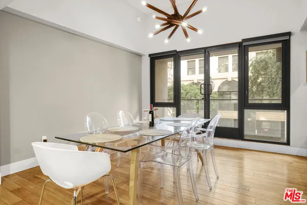 a view of a dining room with furniture window and outside view