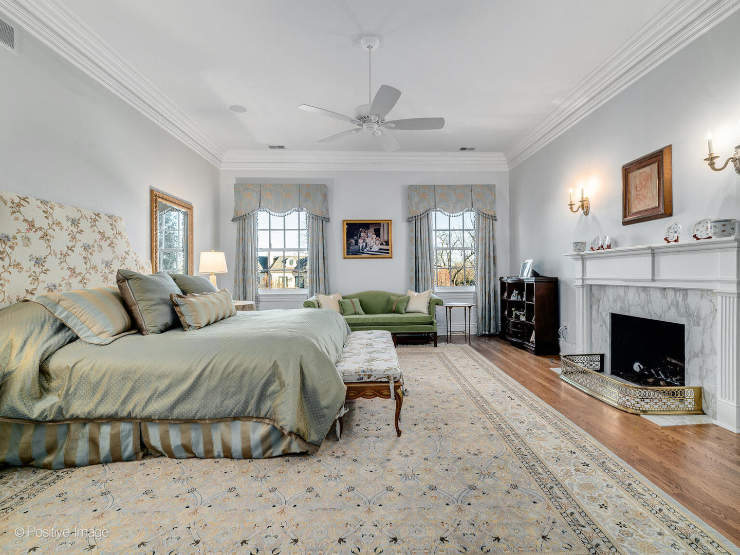 820 Taft Road Hinsdale, IL 60521 - Photo 15 of 46 a spacious bedroom with a bed and a fireplace