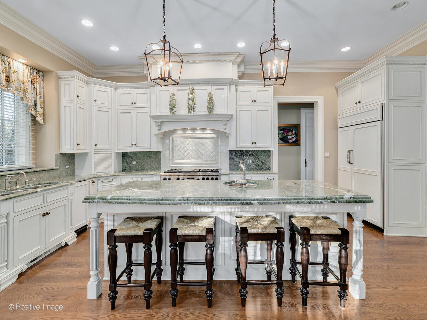 820 Taft Road Hinsdale, IL 60521 - Photo 5 of 46 a large kitchen with granite countertop a table chairs sink and cabinets