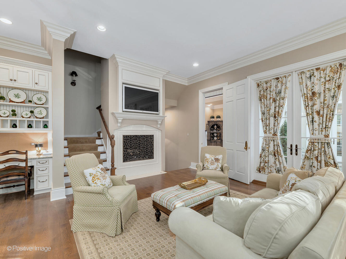 820 Taft Road Hinsdale, IL 60521 - Photo 9 of 46 a living room with furniture a flat screen tv and a fireplace