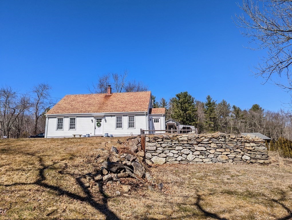 187 Freeman Road Charlton, MA 01507 - Photo 1 of 35 a view of a house with a yard