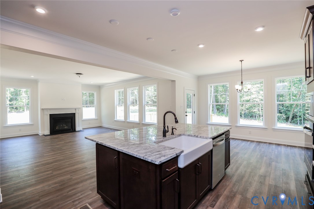 4660 McGhee House Road Mechanicsville, VA 23111 - Photo 11 of 48 a kitchen with a table chairs and wooden floor