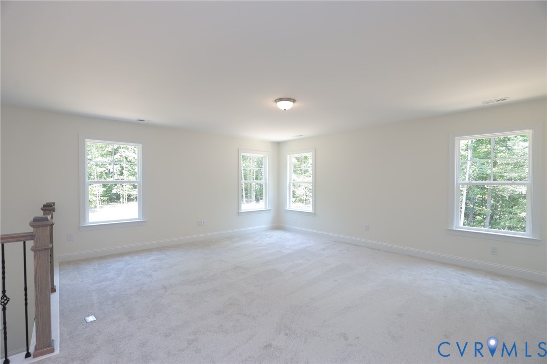 4660 McGhee House Road Mechanicsville, VA 23111 - Photo 19 of 48 a view of a big room with windows and chandelier fan