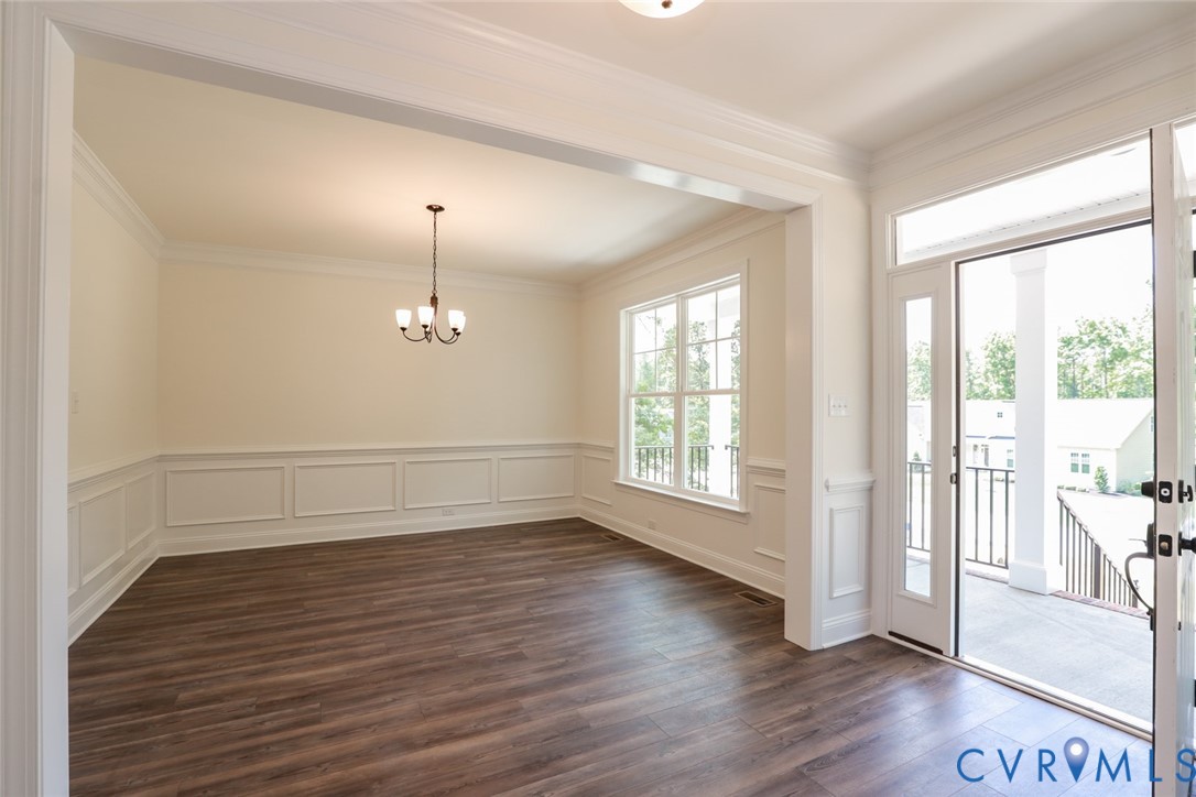 4660 McGhee House Road Mechanicsville, VA 23111 - Photo 2 of 48 an empty room with wooden floor and windows