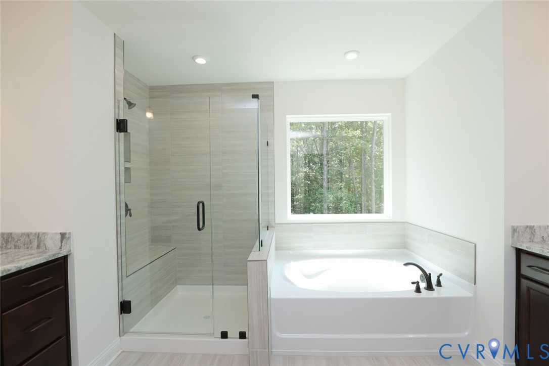 4660 McGhee House Road Mechanicsville, VA 23111 - Photo 26 of 48 a bathroom with a bathtub and a shower