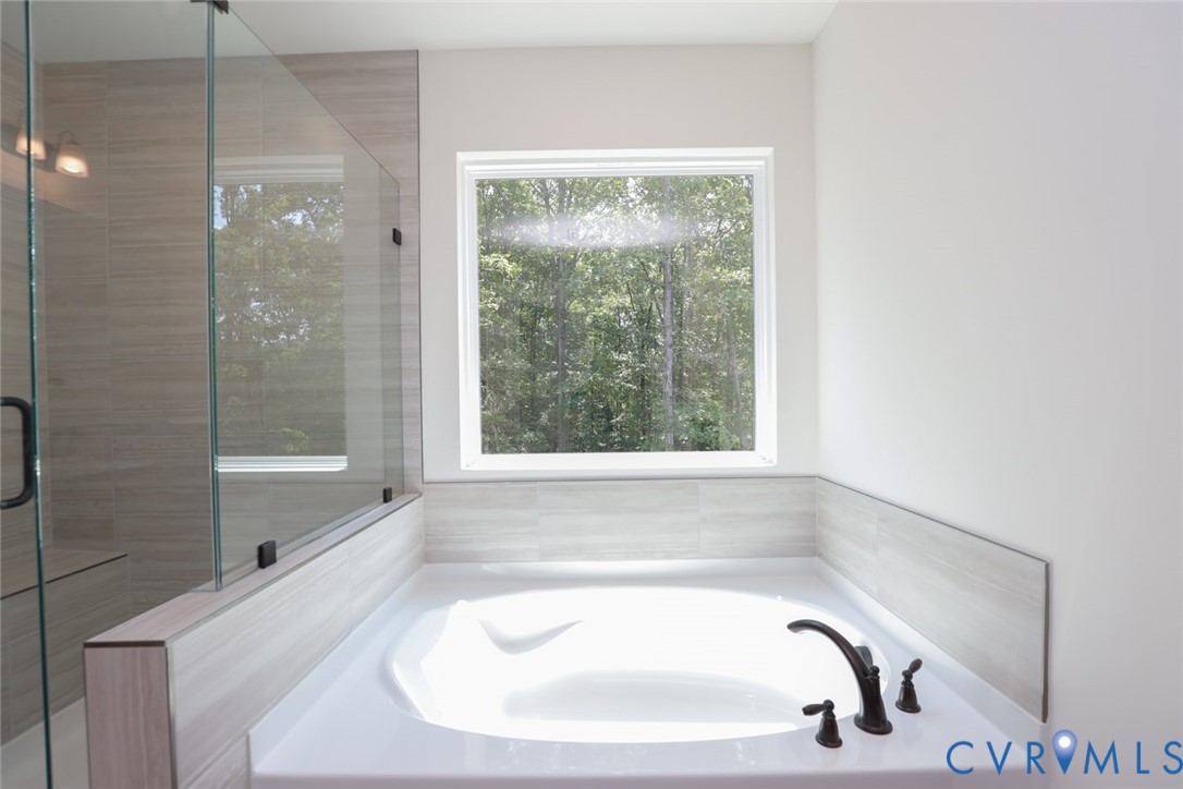 4660 McGhee House Road Mechanicsville, VA 23111 - Photo 27 of 48 a bathroom with a sink and a bathtub
