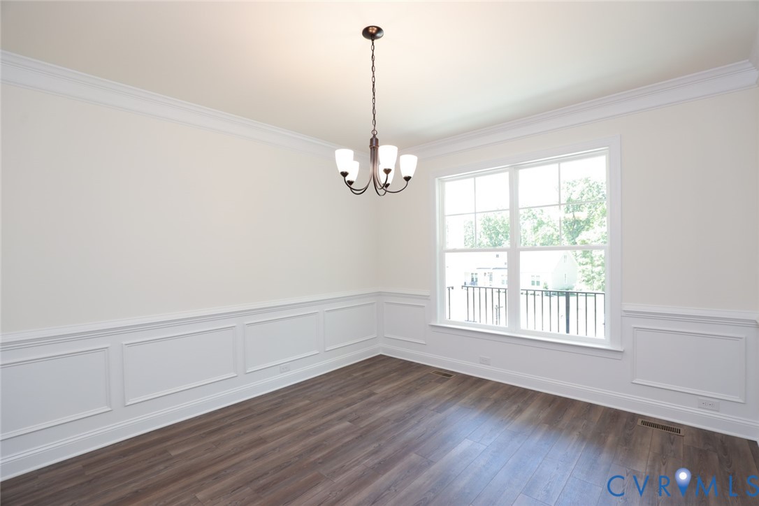 4660 McGhee House Road Mechanicsville, VA 23111 - Photo 3 of 48 a view of an empty room with wooden floor and a window