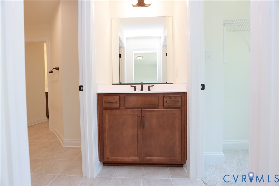 4660 McGhee House Road Mechanicsville, VA 23111 - Photo 32 of 48 a bathroom with a sink and a mirror