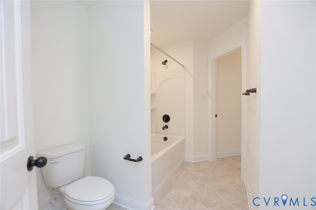 4660 McGhee House Road Mechanicsville, VA 23111 - Photo 33 of 48 a bathroom with a toilet a sink and shower