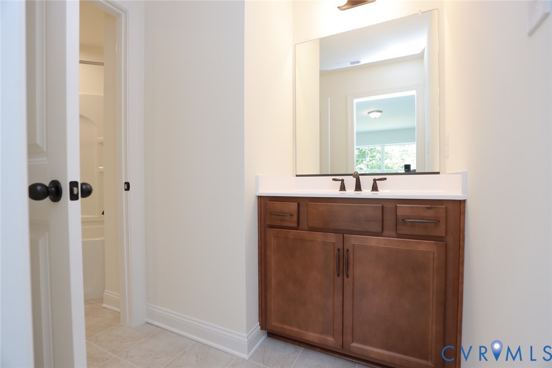 4660 McGhee House Road Mechanicsville, VA 23111 - Photo 34 of 48 a bathroom with a sink and a mirror