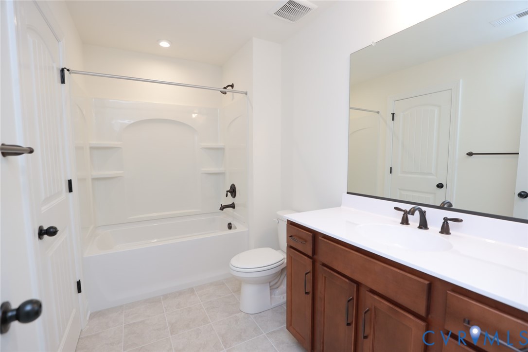 4660 McGhee House Road Mechanicsville, VA 23111 - Photo 38 of 48 a bathroom with a sink a toilet and shower