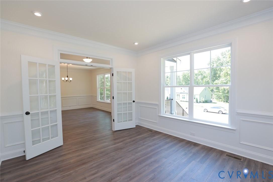 4660 McGhee House Road Mechanicsville, VA 23111 - Photo 5 of 48 a view of an empty room with wooden floor and a window