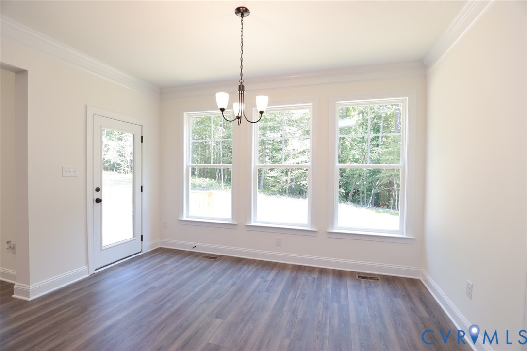 4660 McGhee House Road Mechanicsville, VA 23111 - Photo 10 of 48 a view of an empty room with wooden floor and a window
