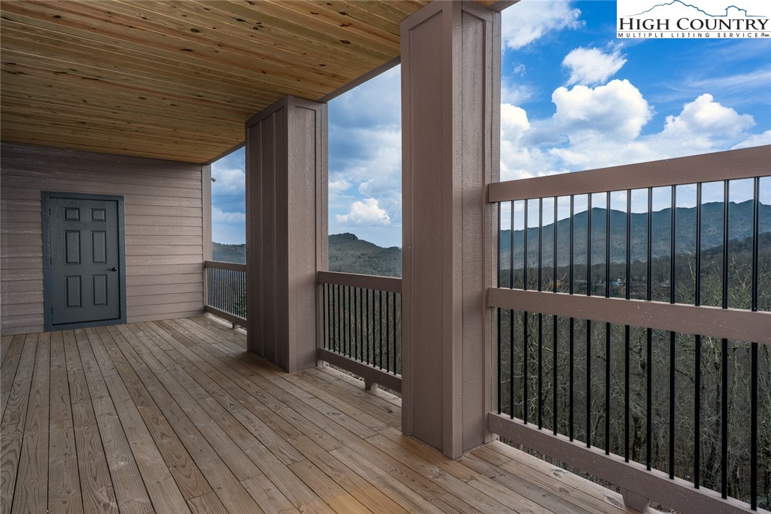 240 Ridgeline Drive, Unit D Sugar Mountain, NC 28604 - Photo 24 of 30 a view of a porch with wooden floor