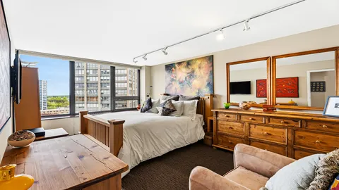 a bed room with a bed and a couch