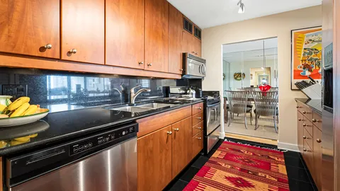 a kitchen that has a sink and a stove