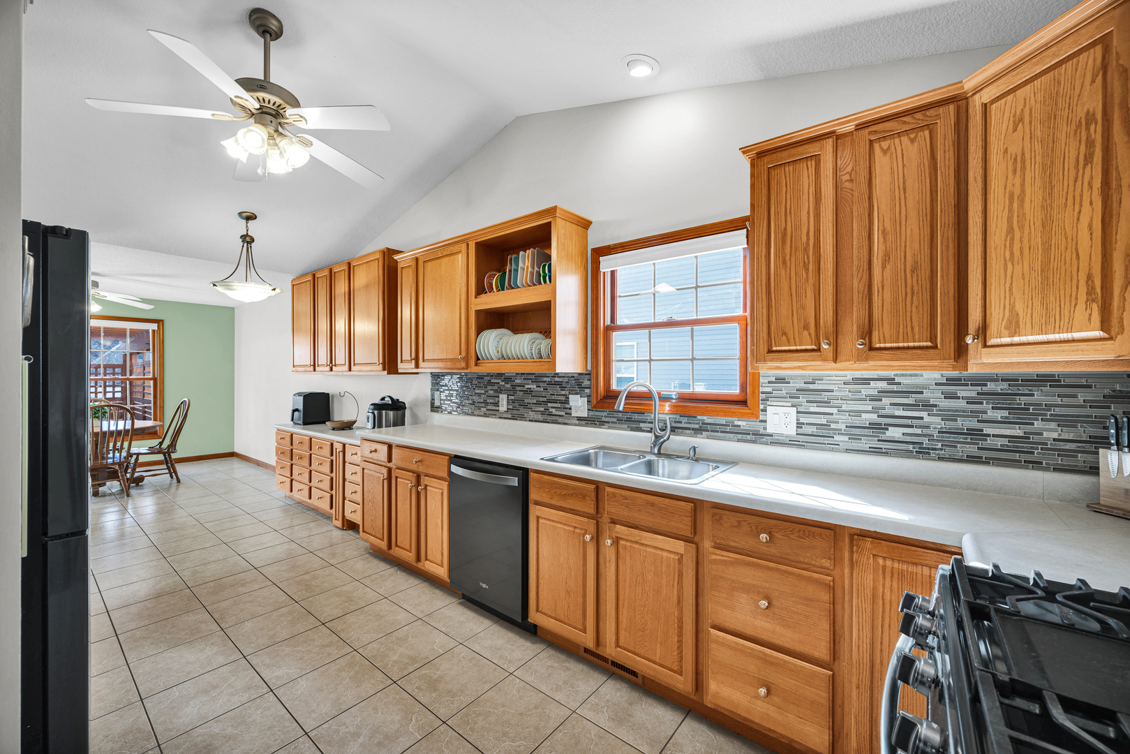 1829 Derek Drive Normal, IL 61761 - Photo 13 of 37 a large kitchen with kitchen island granite countertop a sink stainless steel appliances and cabinets