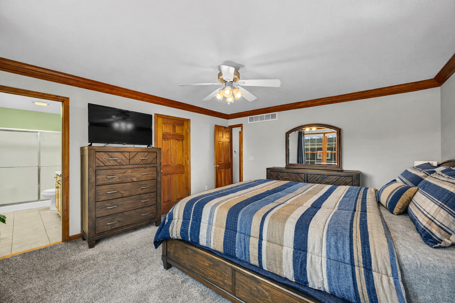 1829 Derek Drive Normal, IL 61761 - Photo 19 of 37 a bedroom with a bed and a chandelier