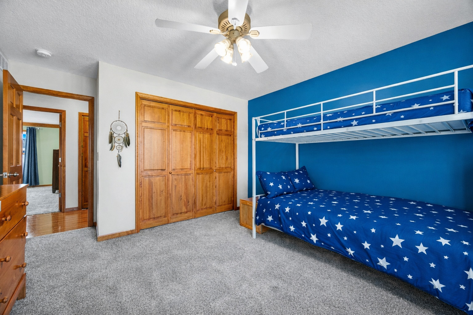 1829 Derek Drive Normal, IL 61761 - Photo 24 of 37 a bedroom with a bed and a chandelier fan