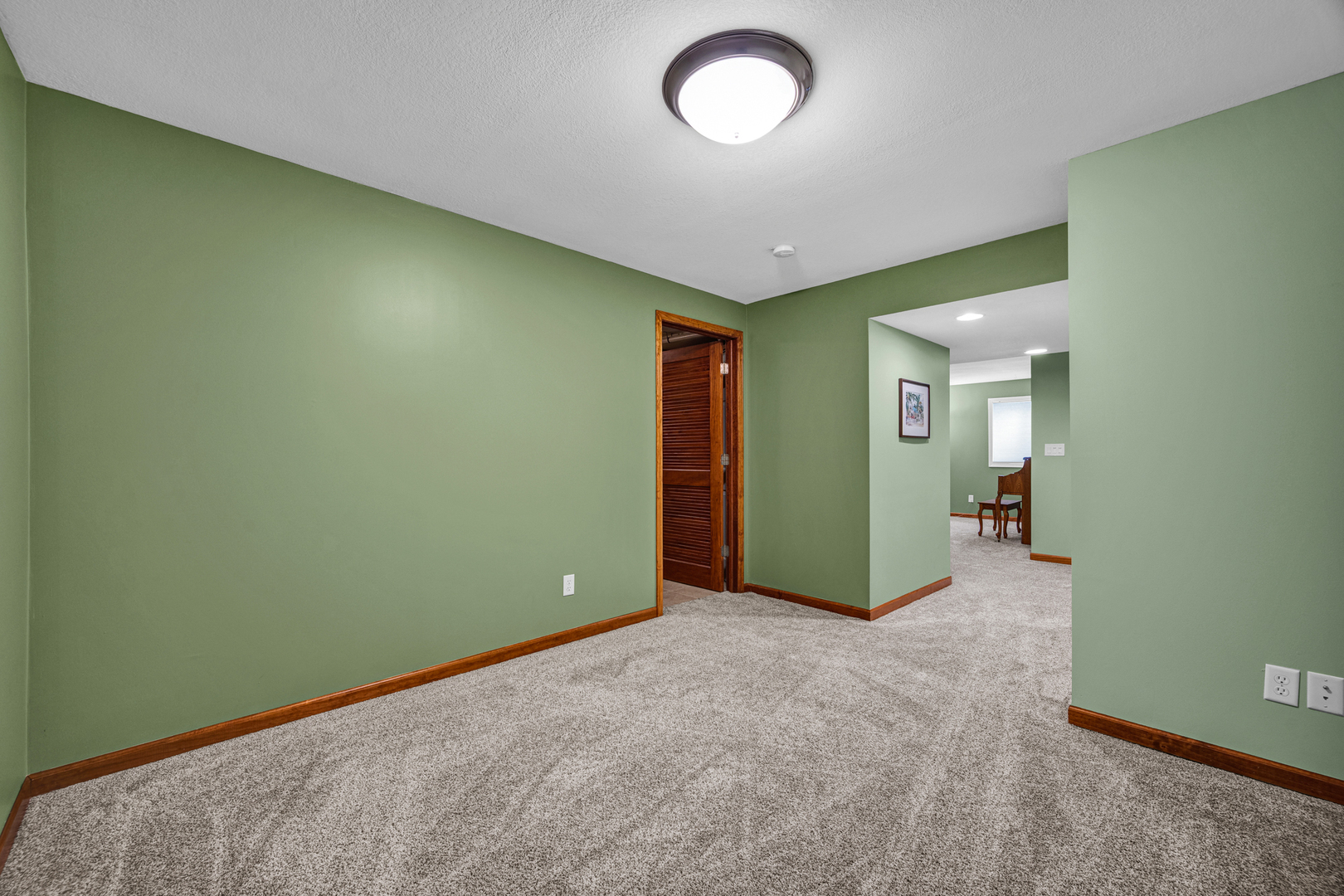 1829 Derek Drive Normal, IL 61761 - Photo 27 of 37 an empty room with closet and mirror