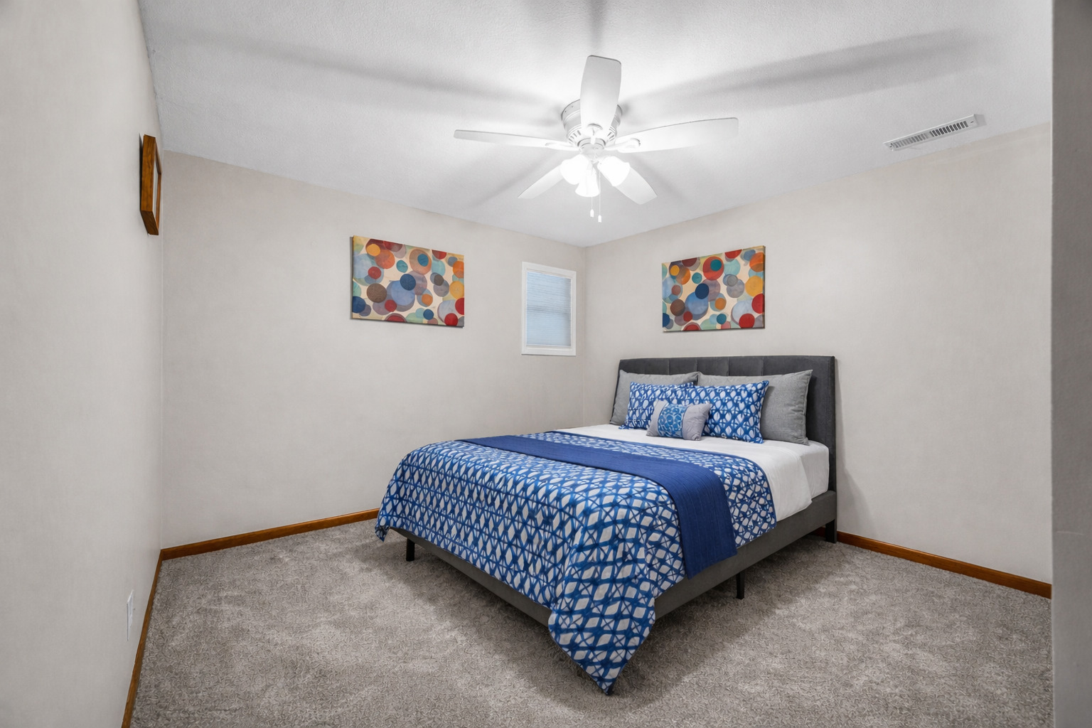 1829 Derek Drive Normal, IL 61761 - Photo 30 of 37 a bedroom with a bed and a chandelier