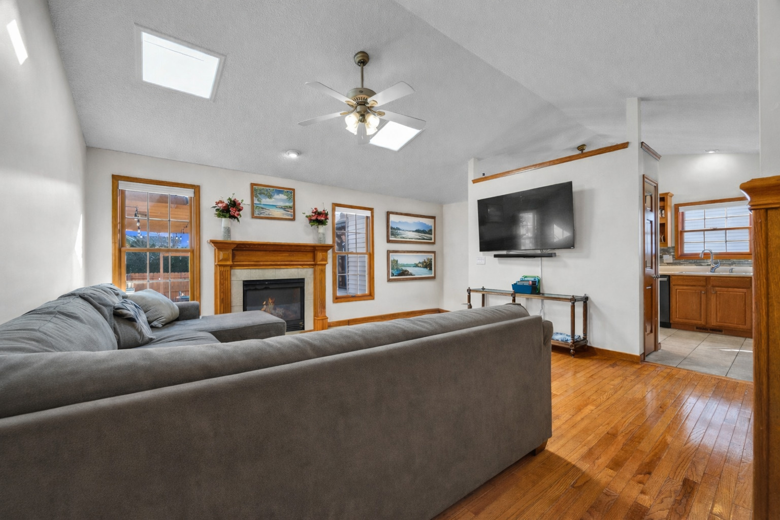 1829 Derek Drive Normal, IL 61761 - Photo 4 of 37 a living room with fireplace furniture and a flat screen tv