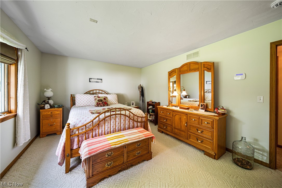 431 Ansel Road Geneva, OH 44041 - Photo 32 of 35 Bedroom featuring light carpet