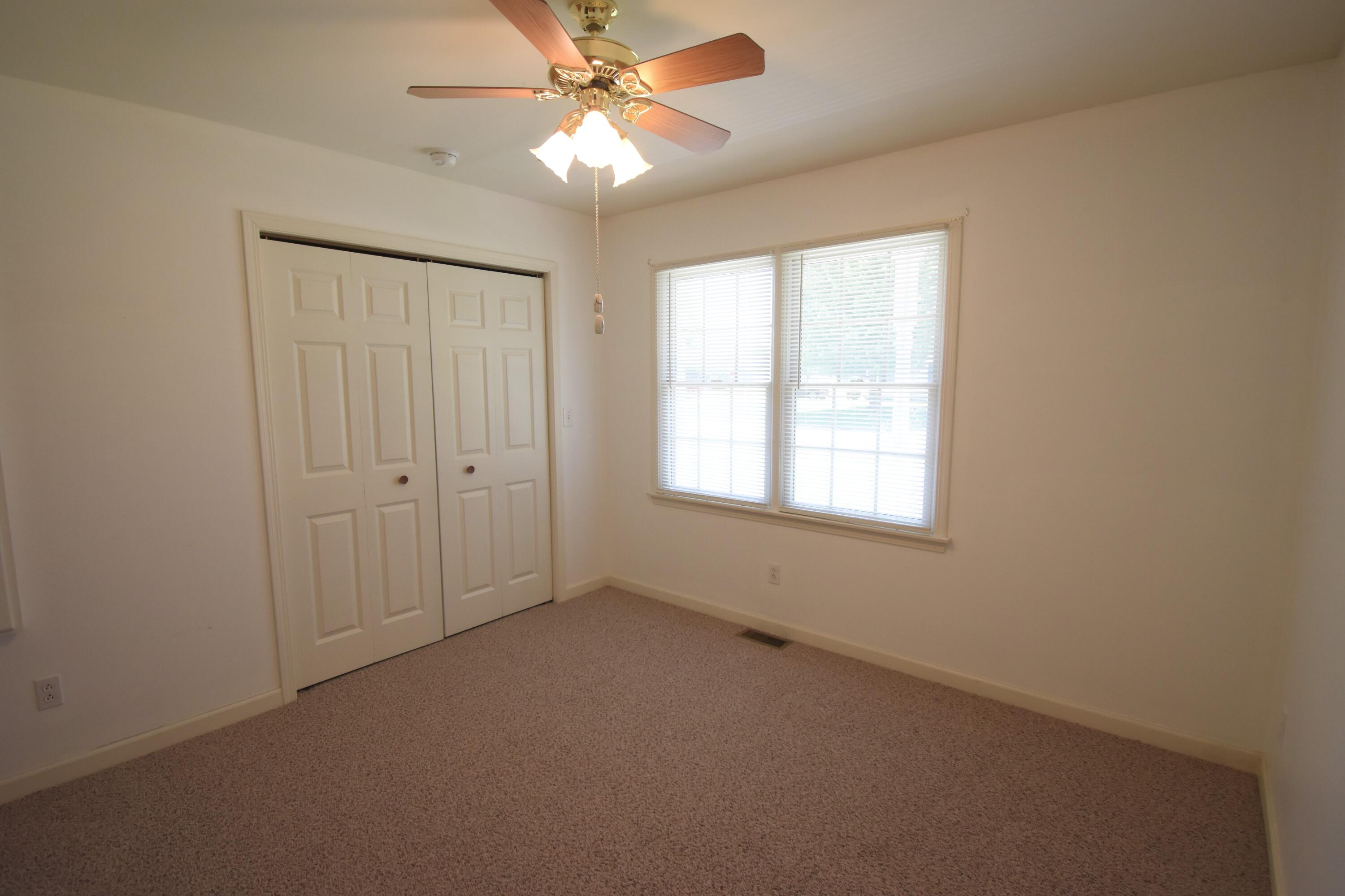 522 Pheasant Run Rensselaer, IN 47978 - Photo 44 of 55 an empty room with a window and a fan
