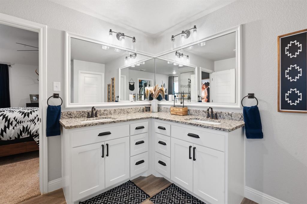 121 Treys Way Godley, TX 76044 - Photo 15 of 32 a bathroom with a sink double vanity and a mirror