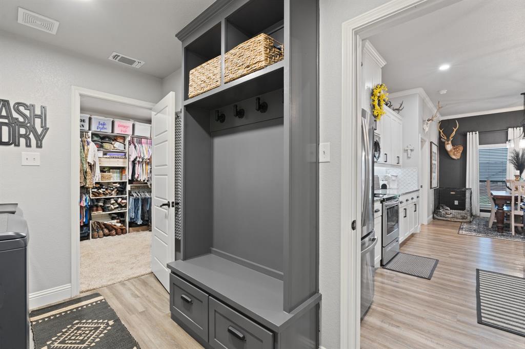 121 Treys Way Godley, TX 76044 - Photo 19 of 32 a kitchen with stainless steel appliances granite countertop a refrigerator and a stove