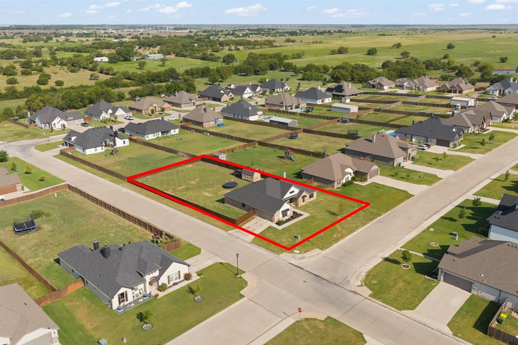 121 Treys Way Godley, TX 76044 - Photo 4 of 32 a view of a pool with lawn chairs and plants
