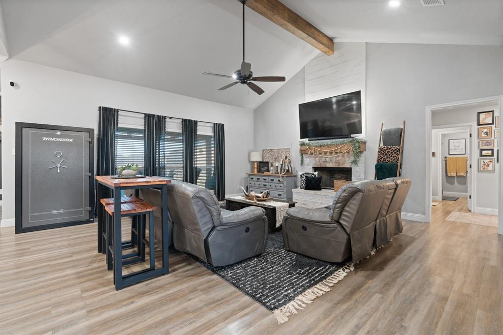 121 Treys Way Godley, TX 76044 - Photo 5 of 32 a living room with furniture fireplace and a flat screen tv