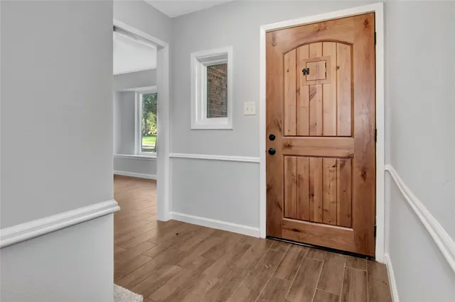 wooden floor with window in an empty room