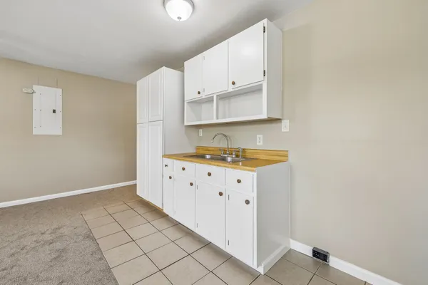 a kitchen with granite countertop white cabinets and granite counter tops