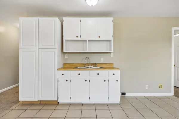a view of cabinets and window