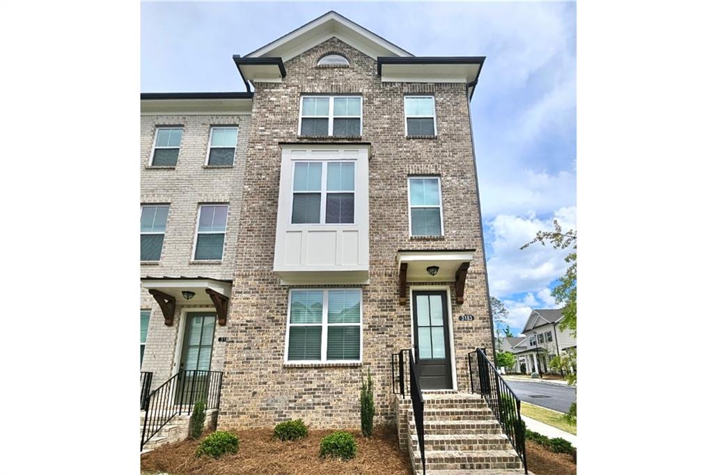 3183 Bartee Walk Suwanee, GA 30024 - Photo 1 of 1 a front view of a house