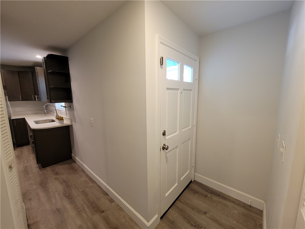 6515 5th Street Vero Beach, FL 32968 - Photo 2 of 36 a view of a hallway with wooden floor and staircase