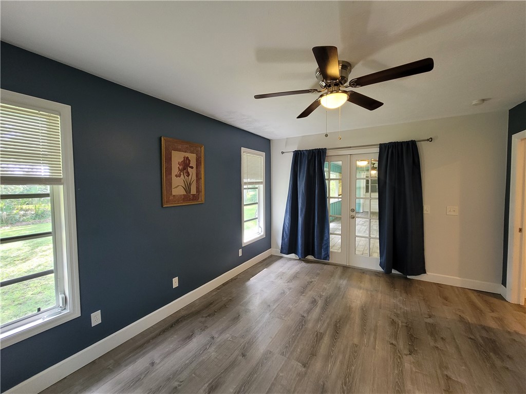 6515 5th Street Vero Beach, FL 32968 - Photo 21 of 36 a view of a livingroom with a window and a ceiling fan