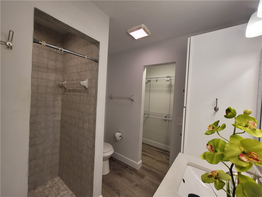 6515 5th Street Vero Beach, FL 32968 - Photo 22 of 36 a bathroom with a shower and a sink