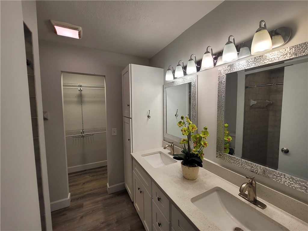 6515 5th Street Vero Beach, FL 32968 - Photo 23 of 36 a bathroom with a double vanity sink and a mirror