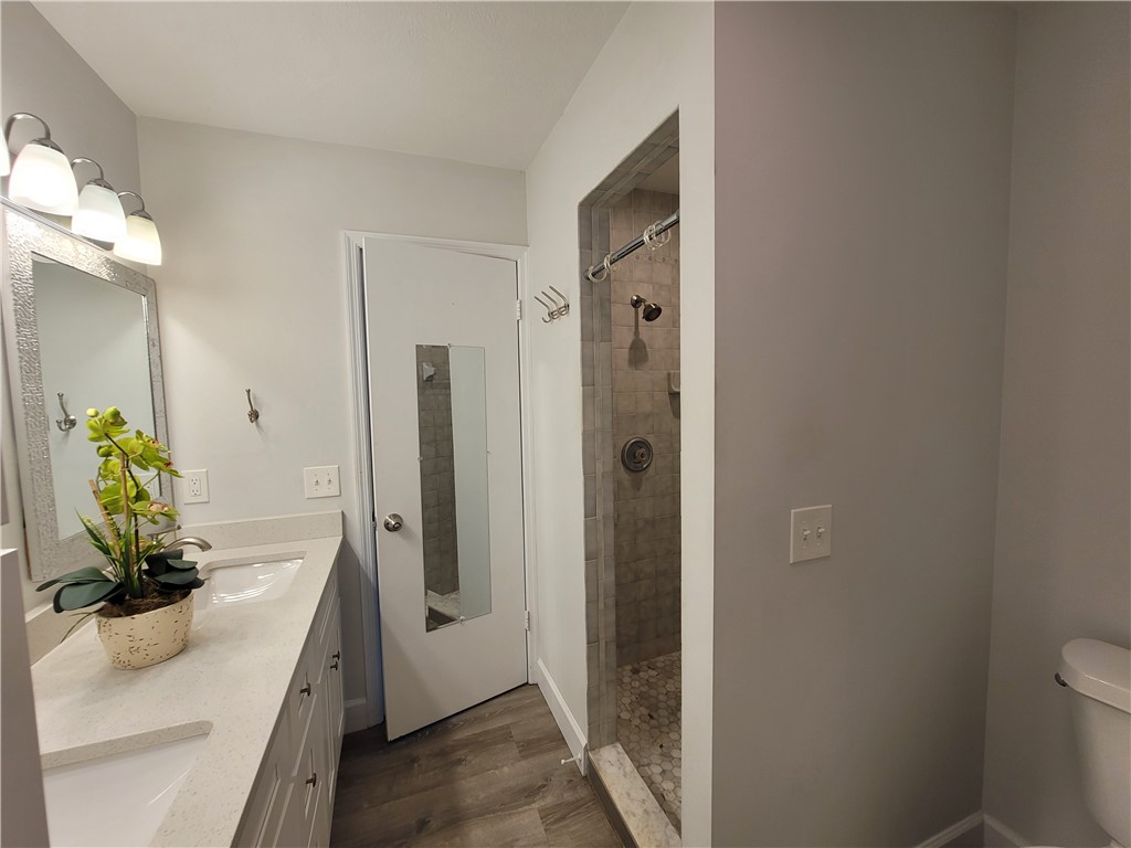 6515 5th Street Vero Beach, FL 32968 - Photo 24 of 36 a bathroom with a sink a toilet and shower