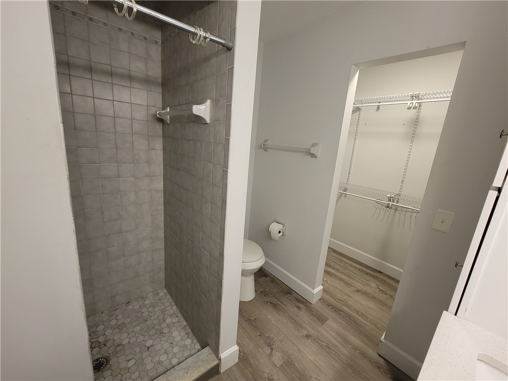 6515 5th Street Vero Beach, FL 32968 - Photo 25 of 36 a bathroom with a granite countertop shower and a toilet