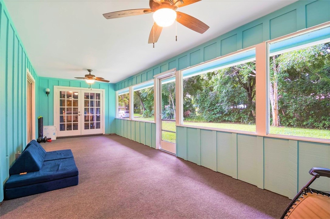 6515 5th Street Vero Beach, FL 32968 - Photo 33 of 36 a living room with furniture and a large window